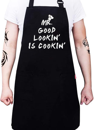 Kitchen Chef Apron - MR. GOOD LOOKIN' IS COOKIN' Funny Aprons for Men Dad - Adjustable Bib Apron with 2 Pockets and 40" Long Ties, Perfect for Cooking, Grilling, BBQ, Baking - Black