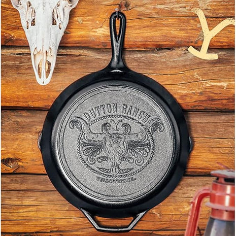 Lodge Pre-Seasoned Yellowstone Stamped Cast Iron Cookware - Signature Teardrop Handle - Use in the Oven, on the Stove, on the Grill, or Over a Campfire - 12 Inch Logo Skillet