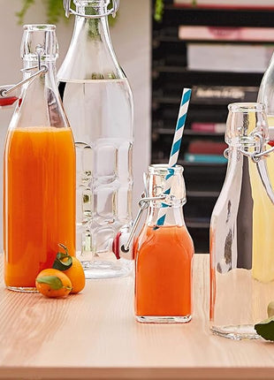 Bormioli Rocco Swing Top Glass Bottle (Set of 4) - 8.5 oz Reusable Container with Secure Metal Clasp, Ideal for Homemade Juices, Oil Infusions, Condiments, Mixers - Everyday Drinking Glasses