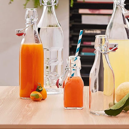 Bormioli Rocco Swing Top Glass Bottle (Set of 4) - 8.5 oz Reusable Container with Secure Metal Clasp, Ideal for Homemade Juices, Oil Infusions, Condiments, Mixers - Everyday Drinking Glasses