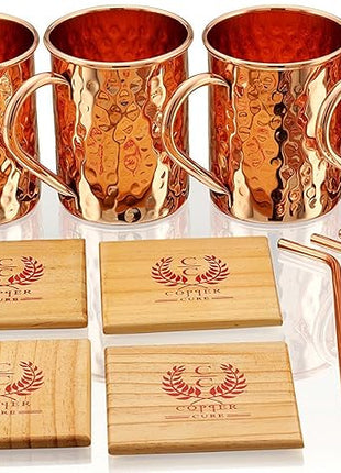 Gift Set Pure Copper Hammered Mugs with Copper Straws & Wooden Coasters Set of 4 - PREMIUM QUALITY -16 Oz Copper Mug - 100% Handcrafted - A Gift Pack for your loved Ones.