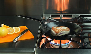 Lodge Manufacturing Company carbon steel skillet, 10-Inch, Black/Orange